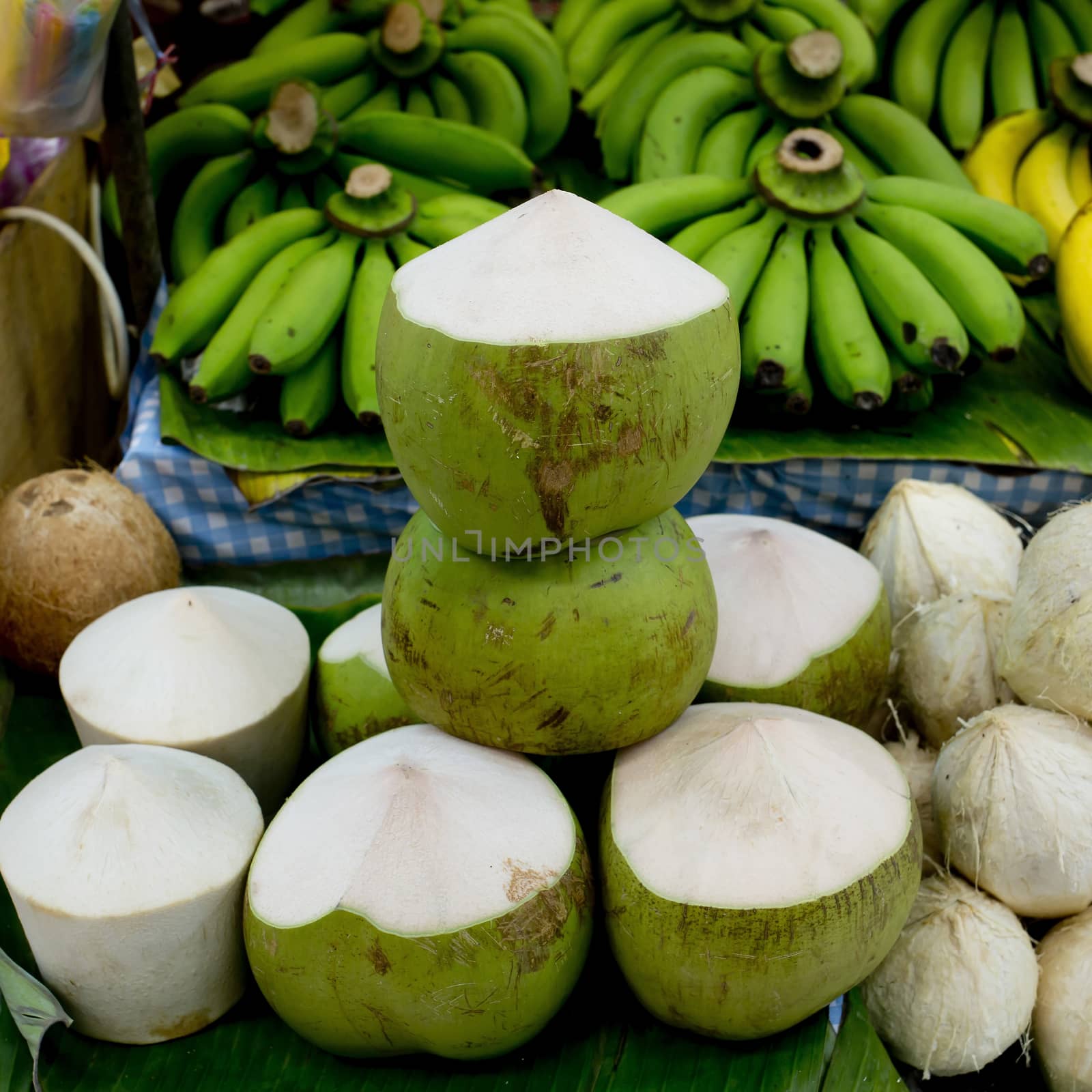 Tender and Fresh Coconut in the market by art9858