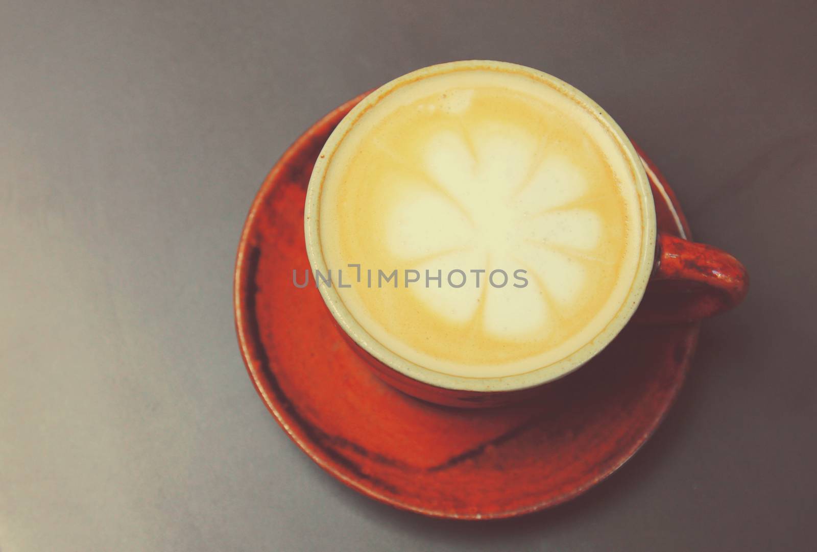 Cappuccino or latte coffee with retro filter effect  by nuchylee