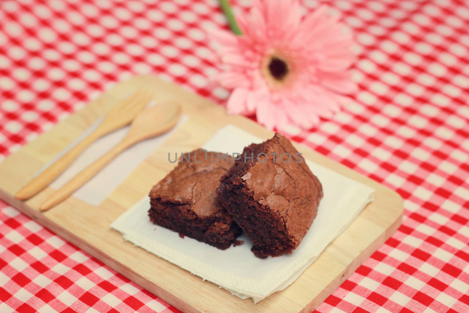 Tasty brownies with wooden spoon and fork, retro filter effect 