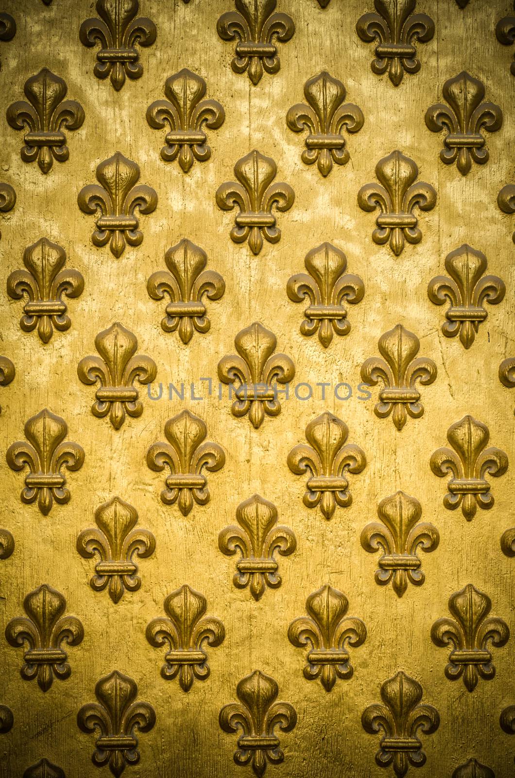 Background Texture Of A Regal, Gold Fleur-de-lis Coat-Of-Arms On Napoleon's Tomb In Paris, France