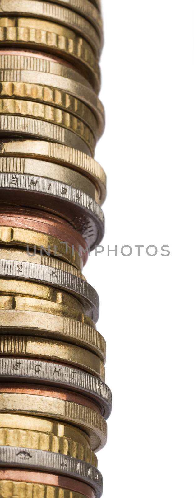 huge tower of different euro coins in close up shot isolated in white background