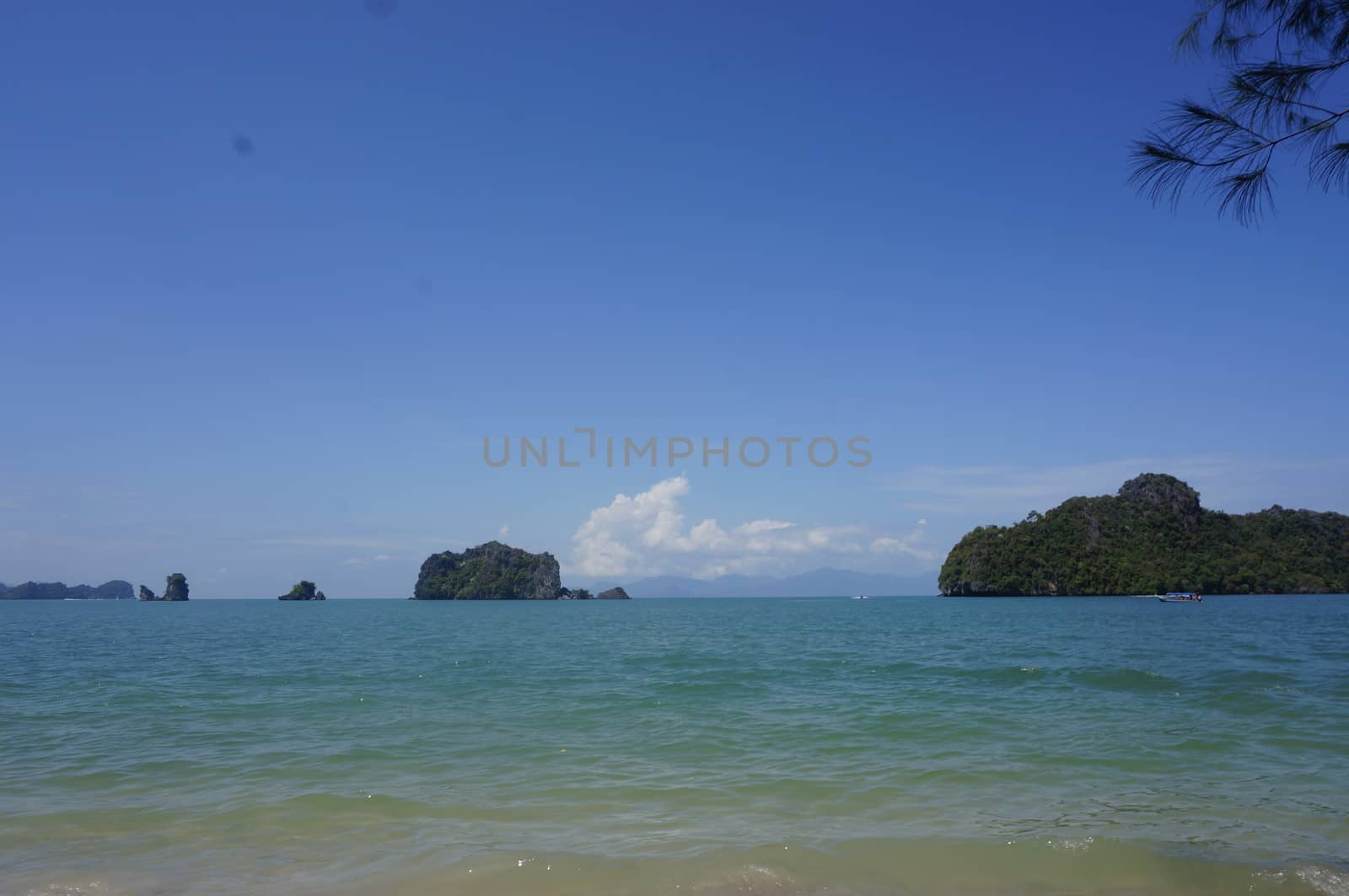 Beautiful beach with white sand, coast of Langkawi. by mcherevan