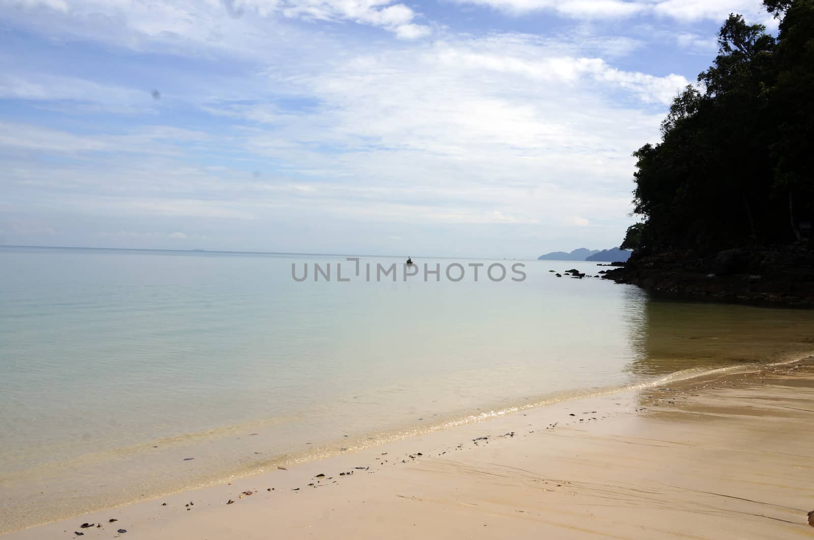 Beautiful beach with white sand, coast of Langkawi. by mcherevan