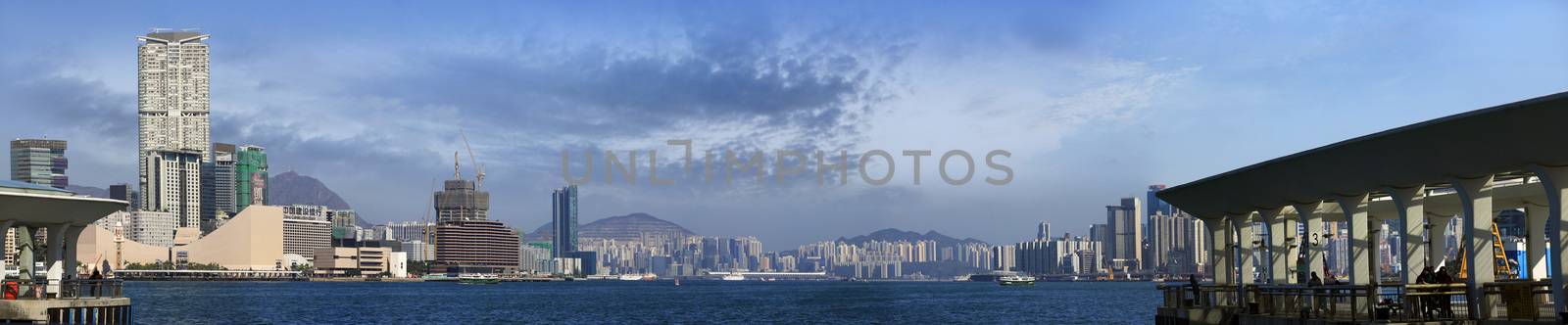 Hong Kong, Hong Kong S.A.R. - JENUARY 29, 2014: Star ferry crossing the Victoria Harbor with a view of Hong Kong Island skyline in the background.