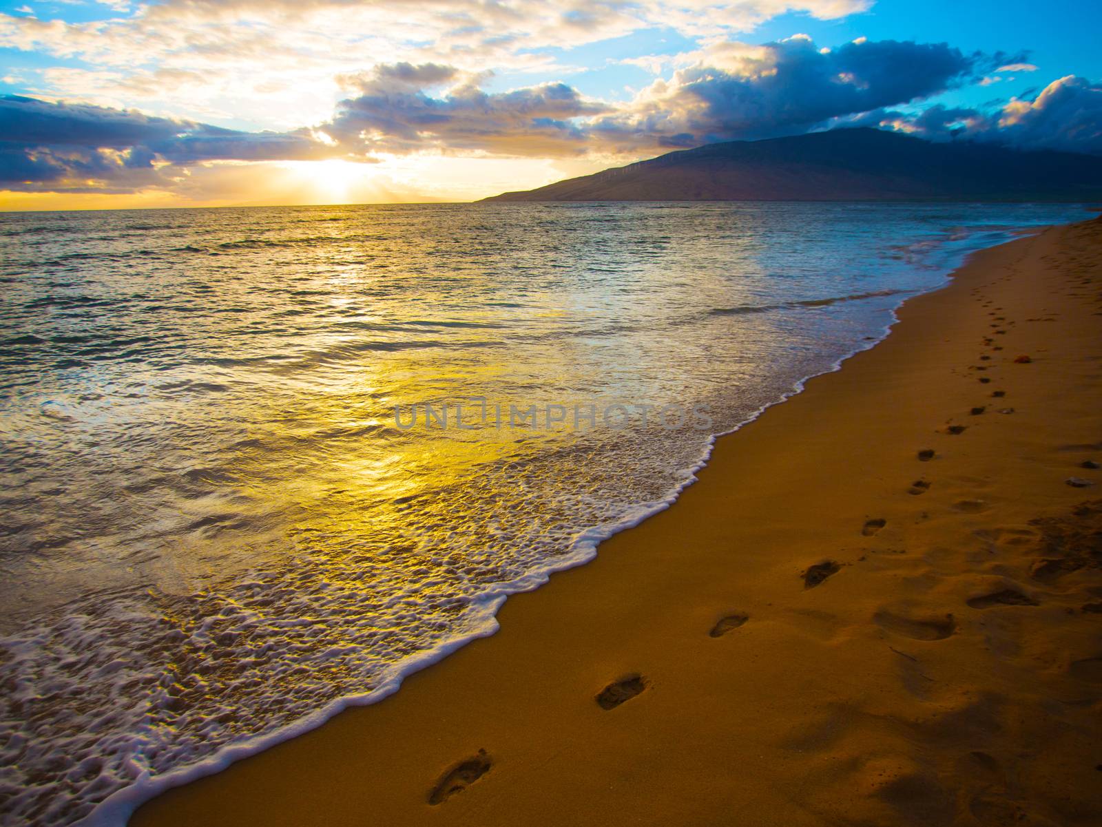 Footprints along beautiful beach on Maui in Hawaii