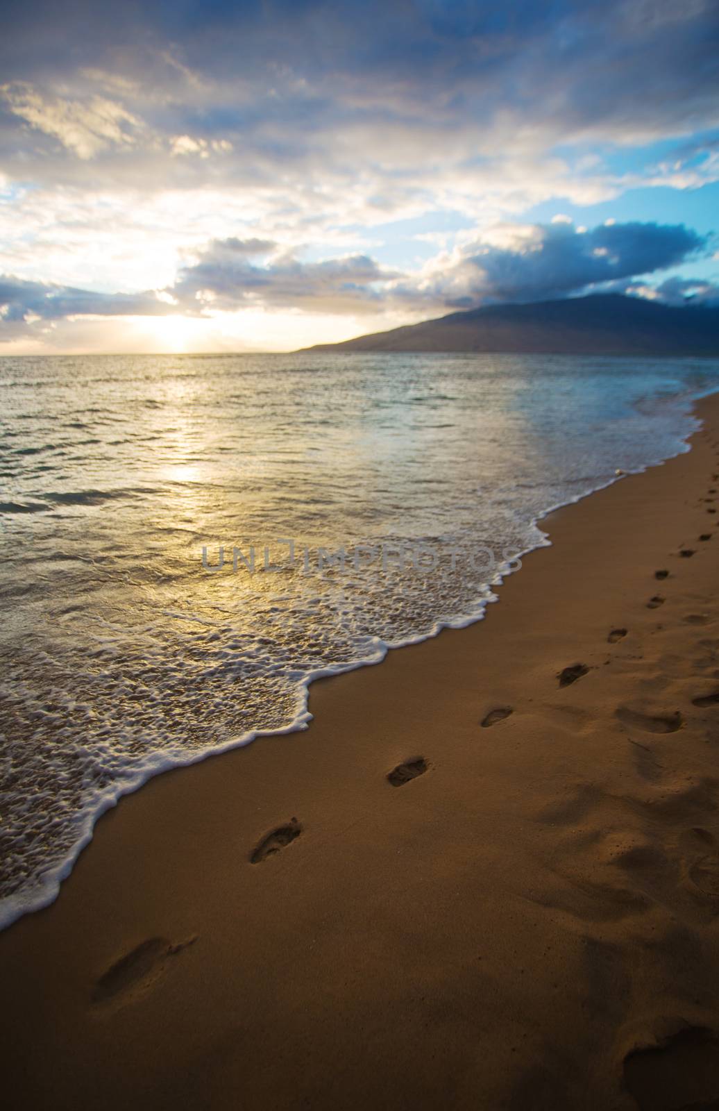 Sunset and Beach Footprints on Maui in Hawaii