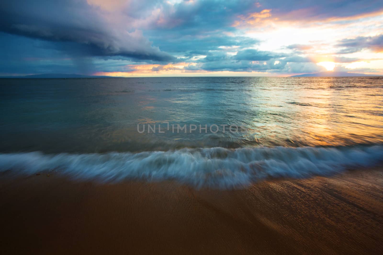 Beach water in motion at sunset in Maui