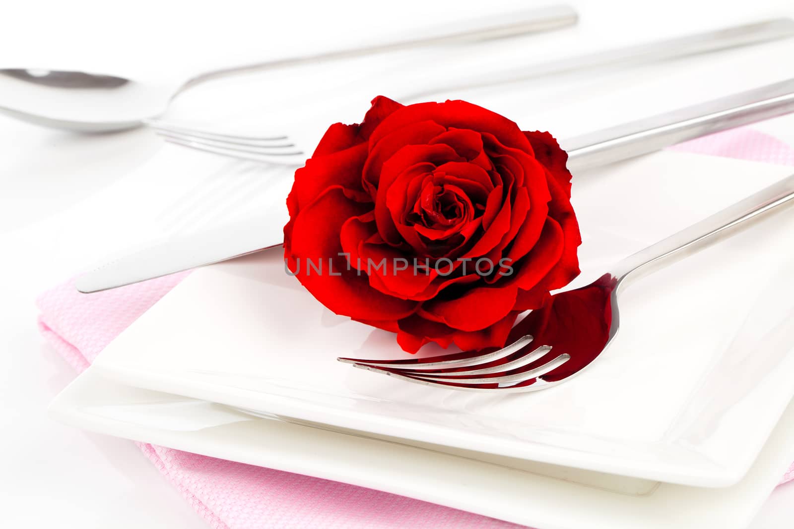 Valentines table setting with an gift box, to celebrate the holi by motorolka