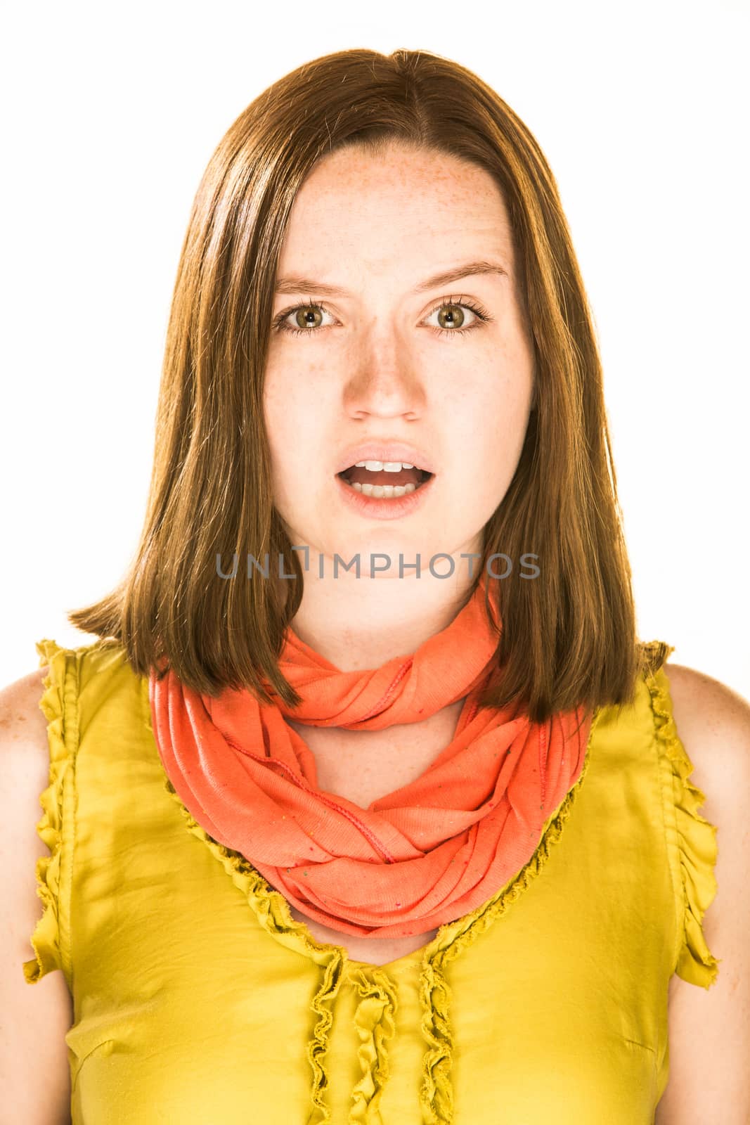 Pretty girl with an unsure expression on white background