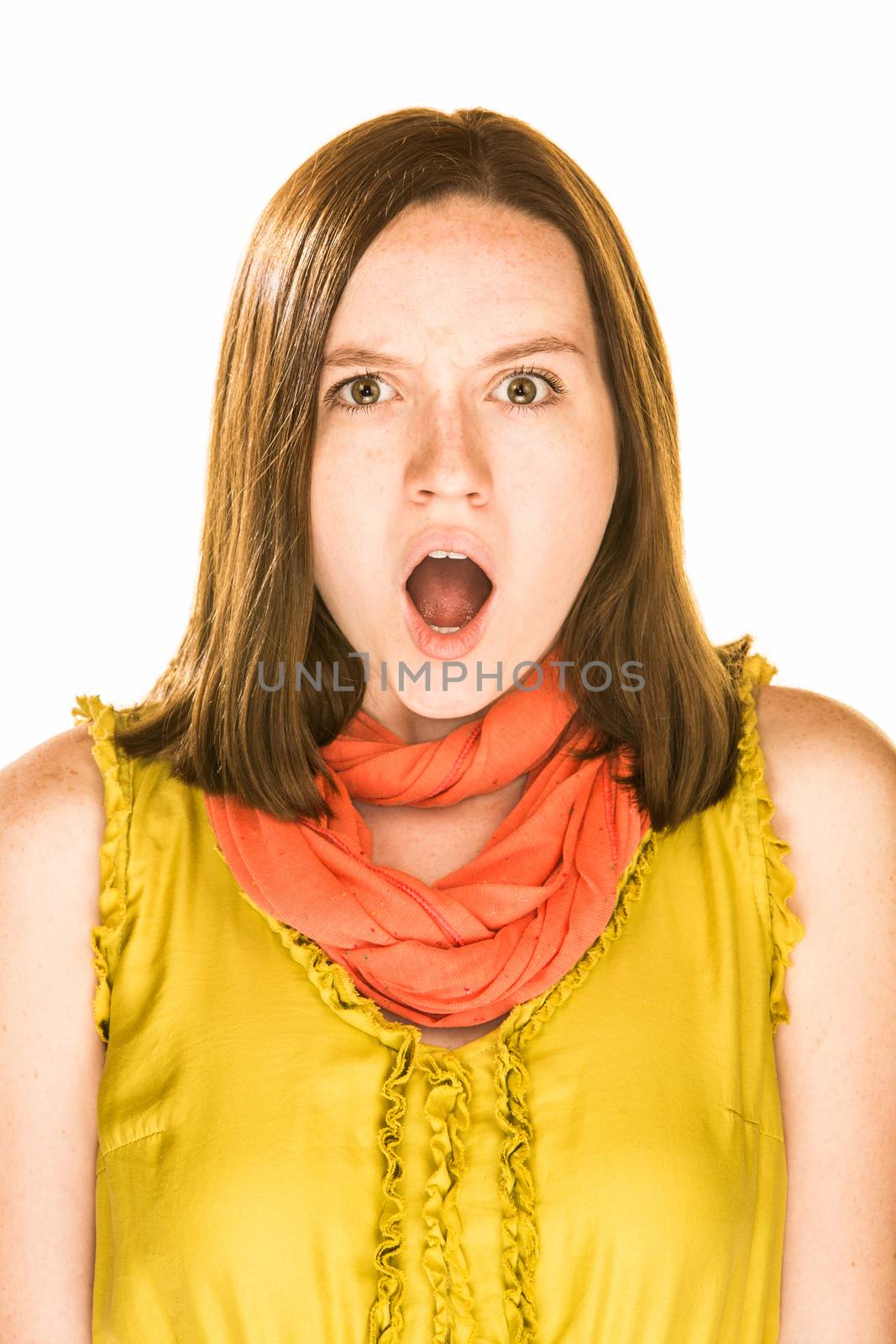 Pretty girl with an afraid expression on white background