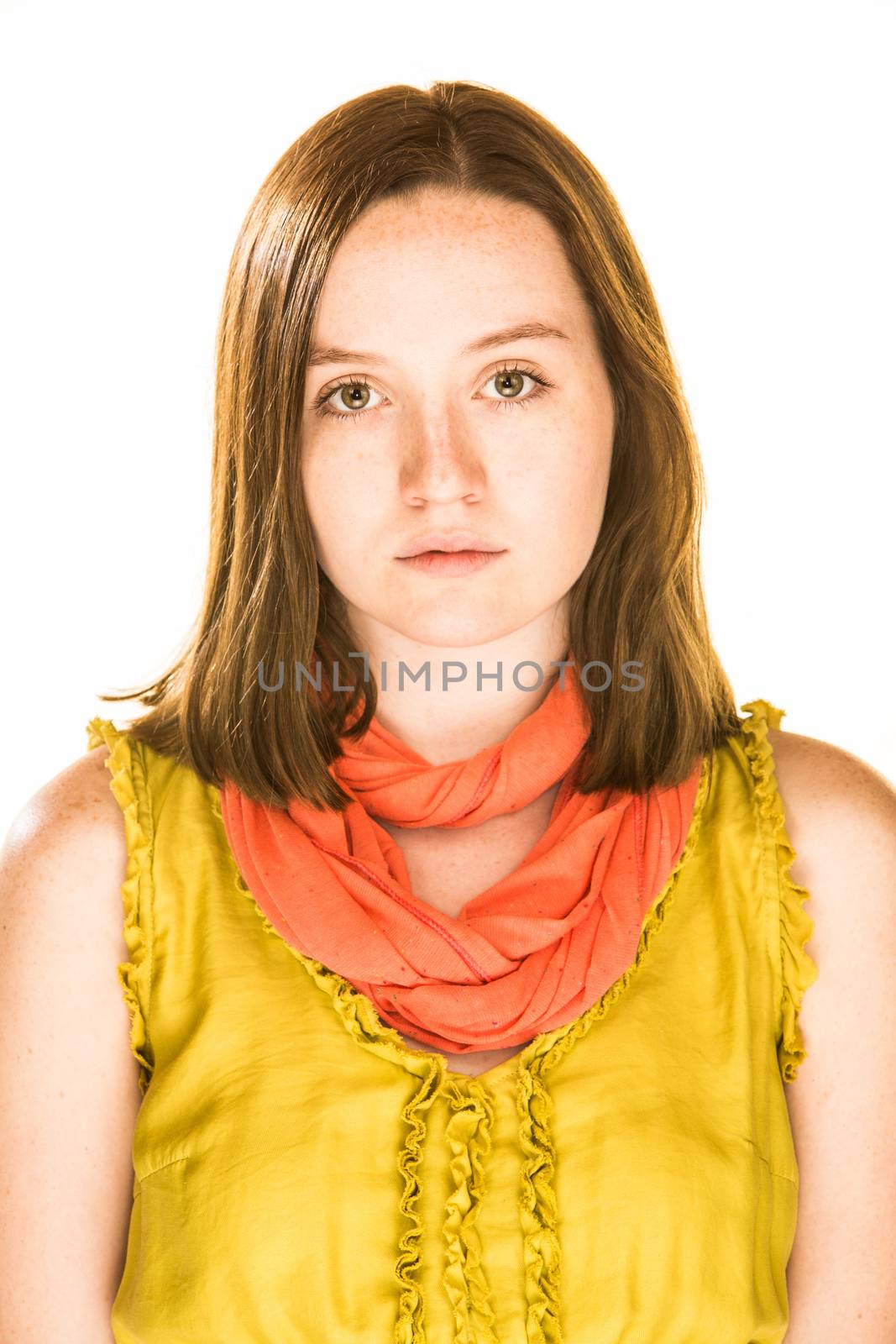 Pretty girl with a deadpan expression on white background