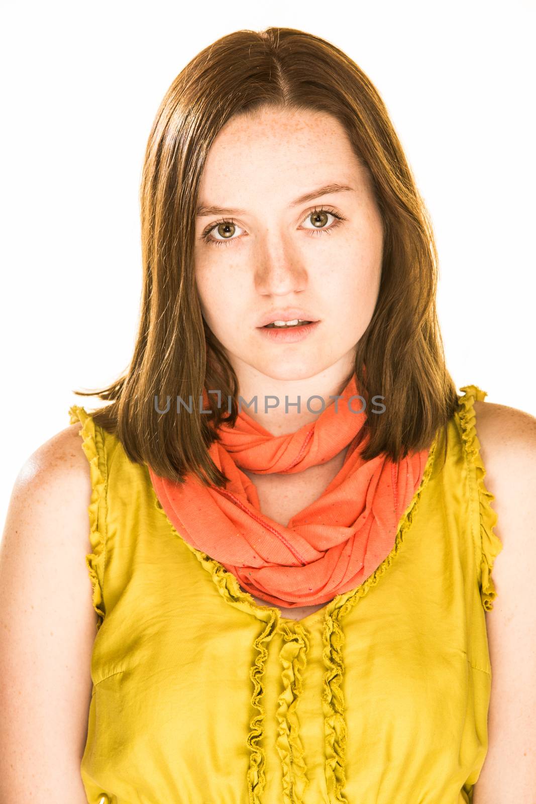 Pretty girl with an upset expression on white background