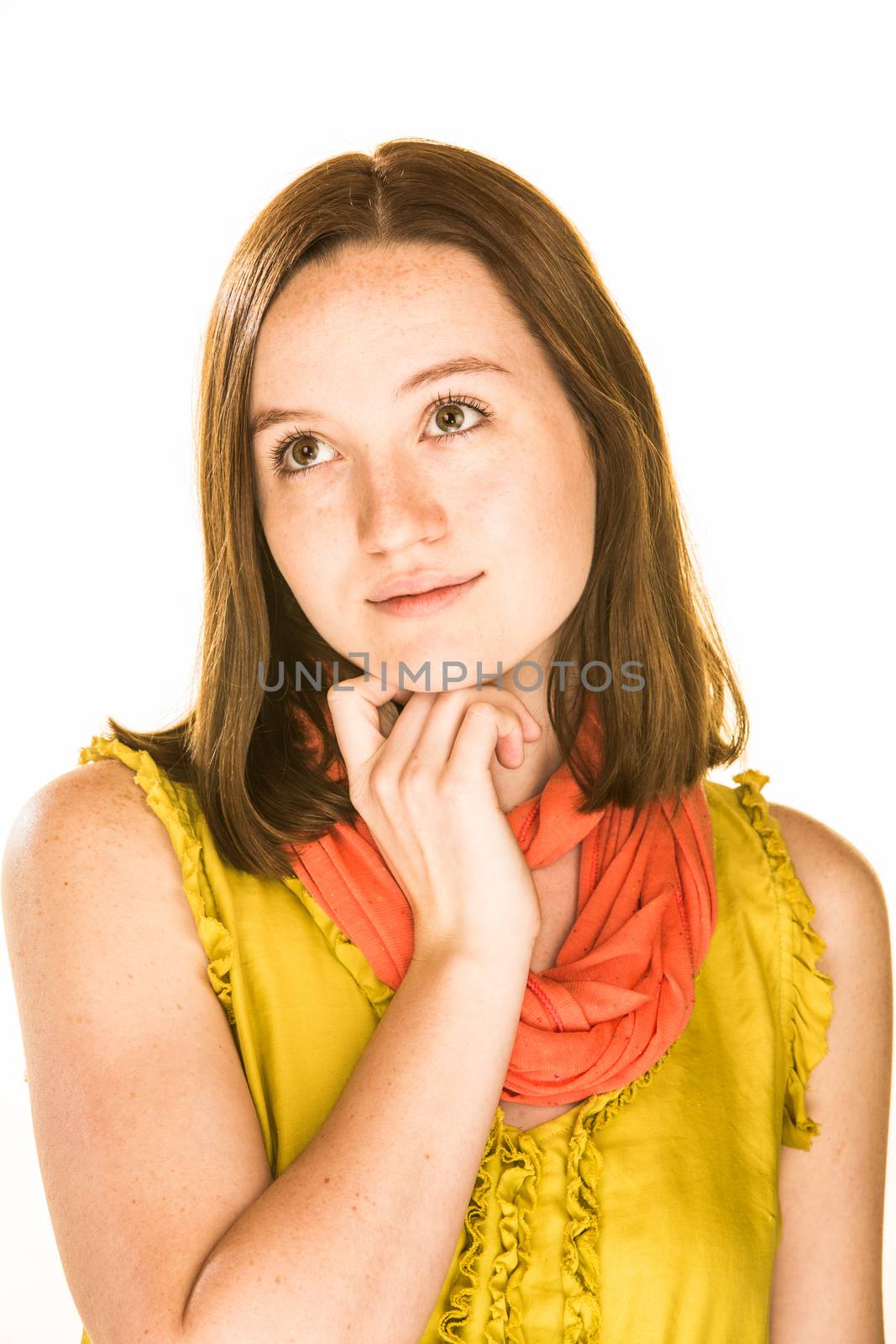 Pretty daydreaming girl on a white background