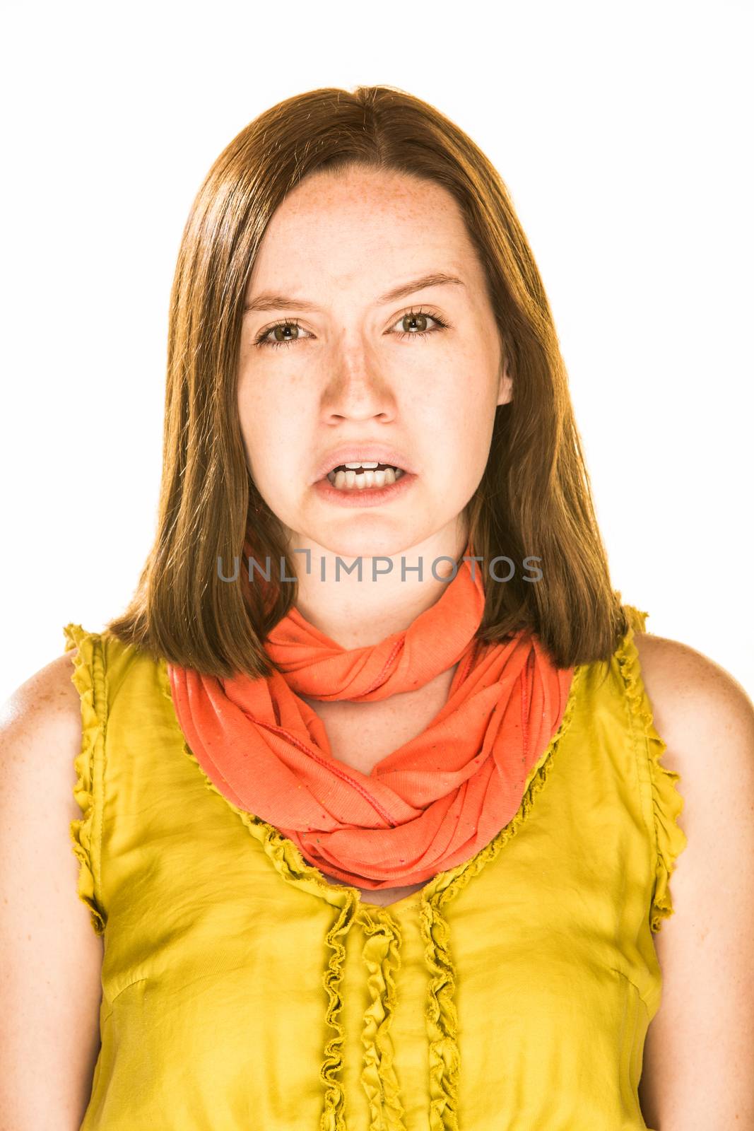 Pretty girl with a sad expression on white background