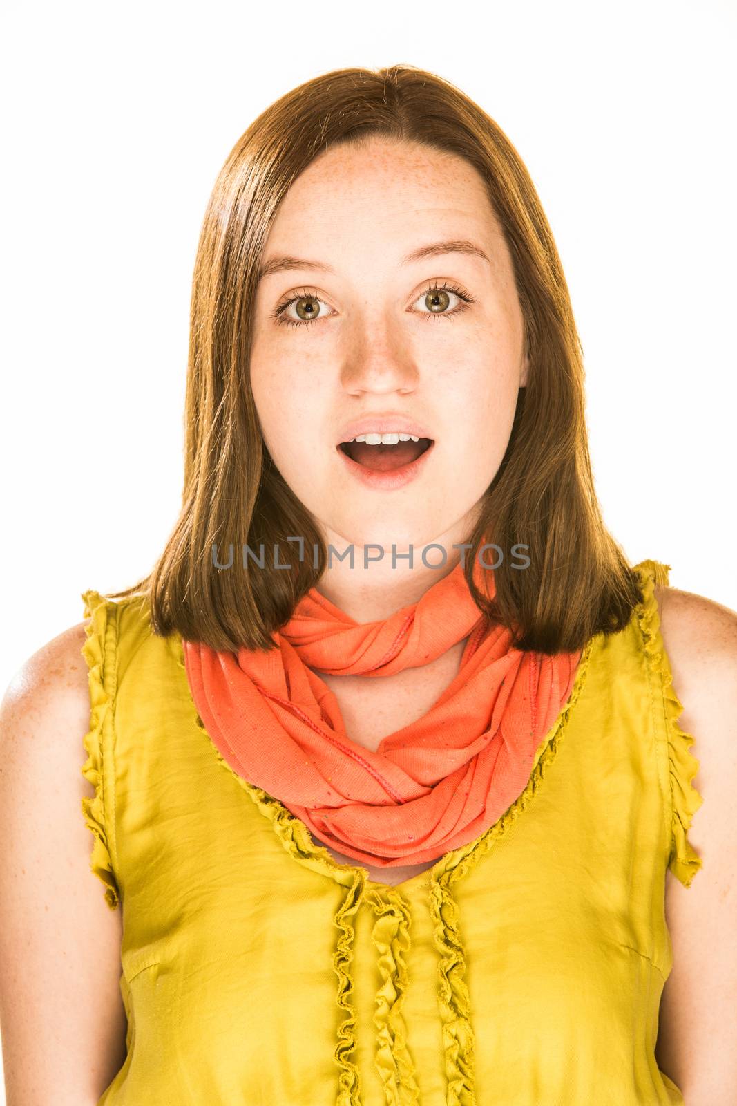 Pretty girl with a wonder filled expression on white background