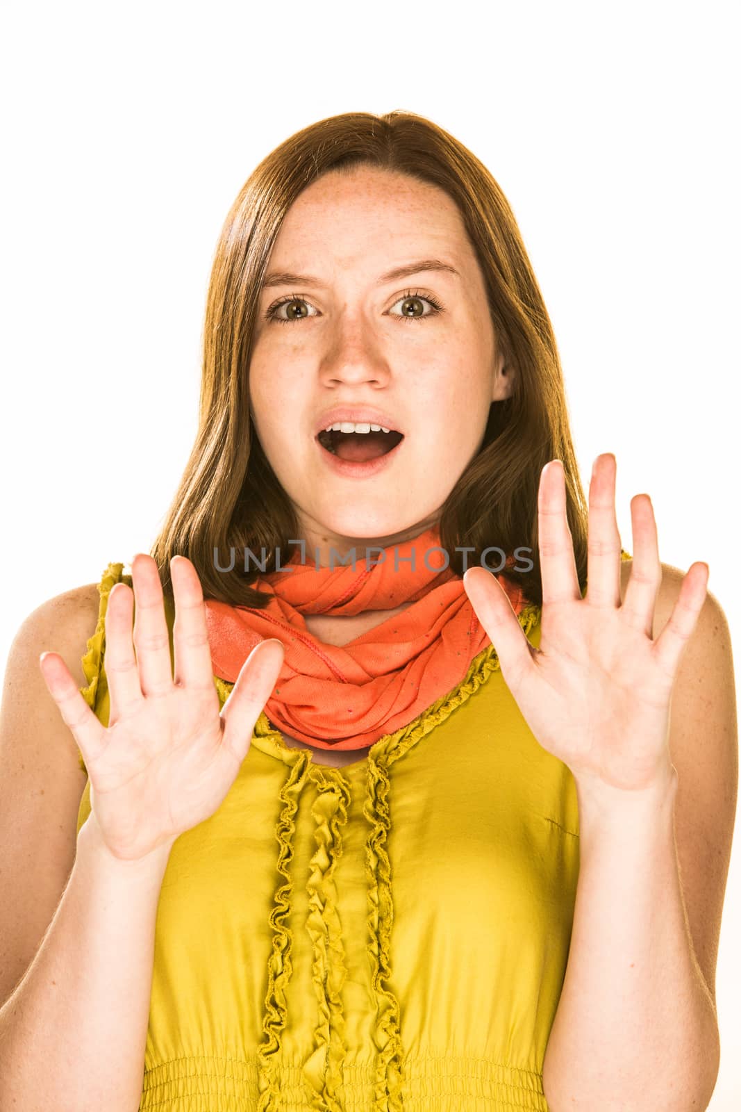 Pretty girl with a shocked expression on white background