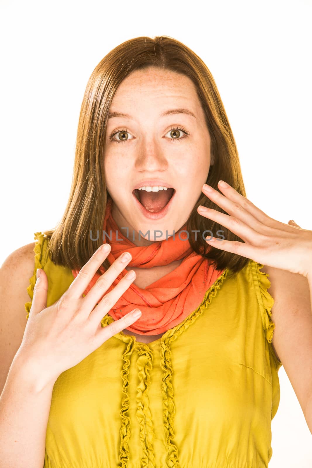 Pretty girl with a surprised expression on white background