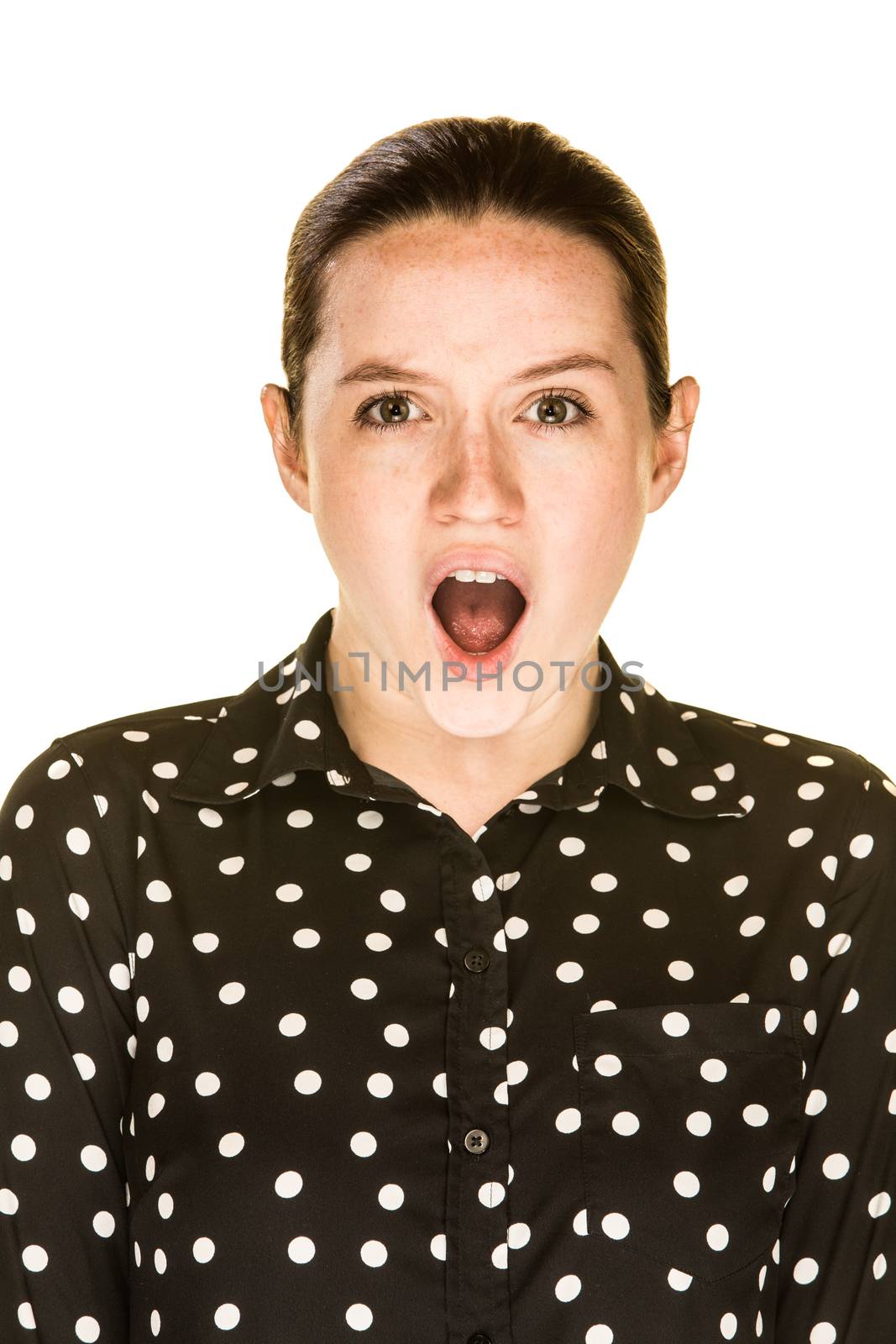 Shocked looking caucasian woman on a white background