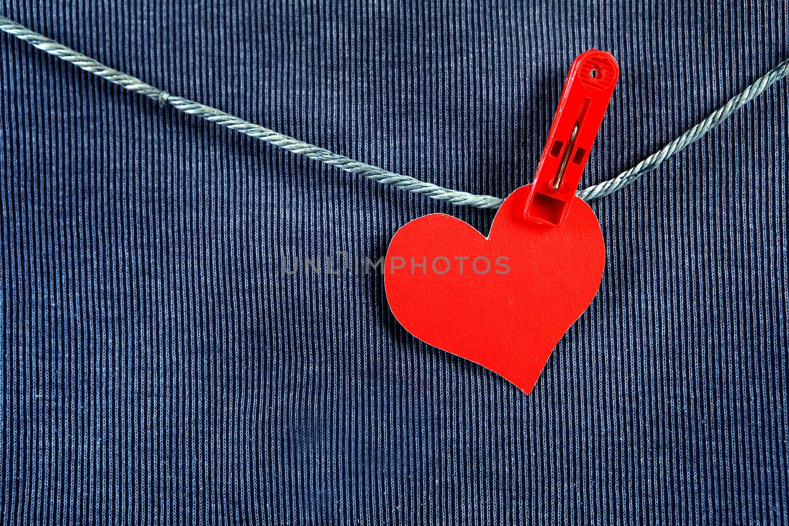 Red Heart Shape on the Rope on the Textile Background