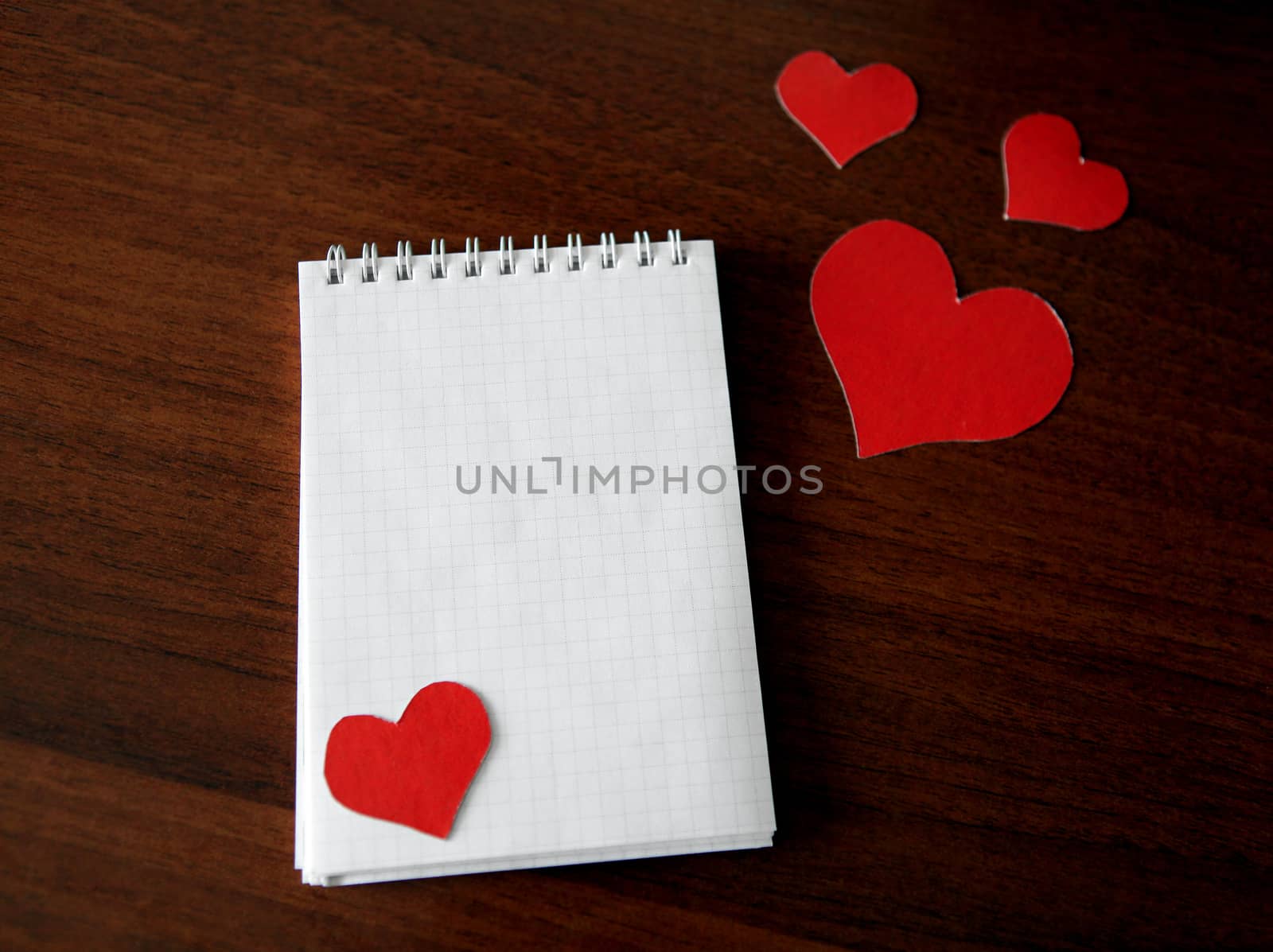 Note Pad with Heart Shapes by sabphoto