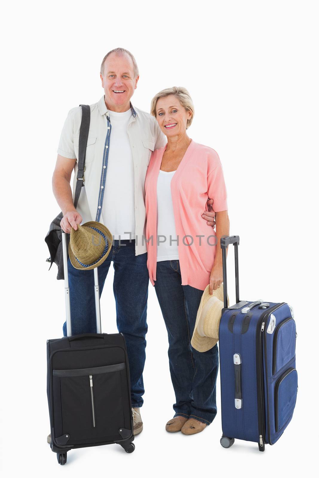 Smiling older couple going on their holidays by Wavebreakmedia