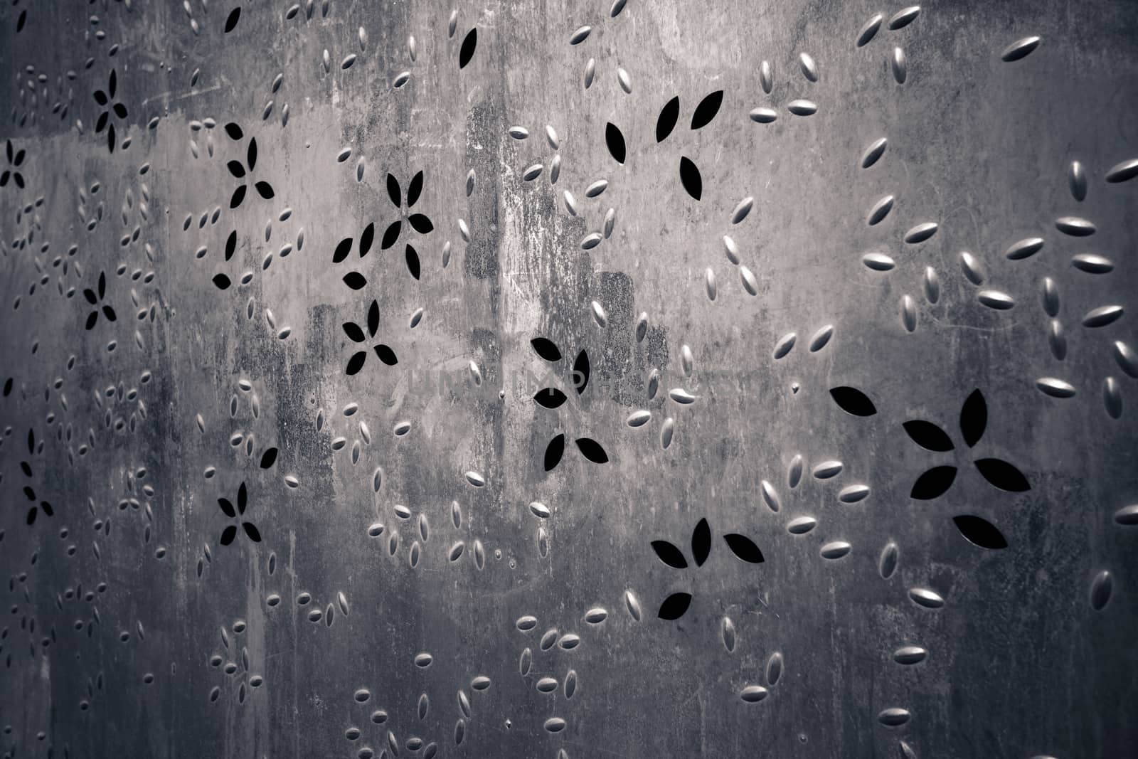 Rusty metallic background with perfored holes