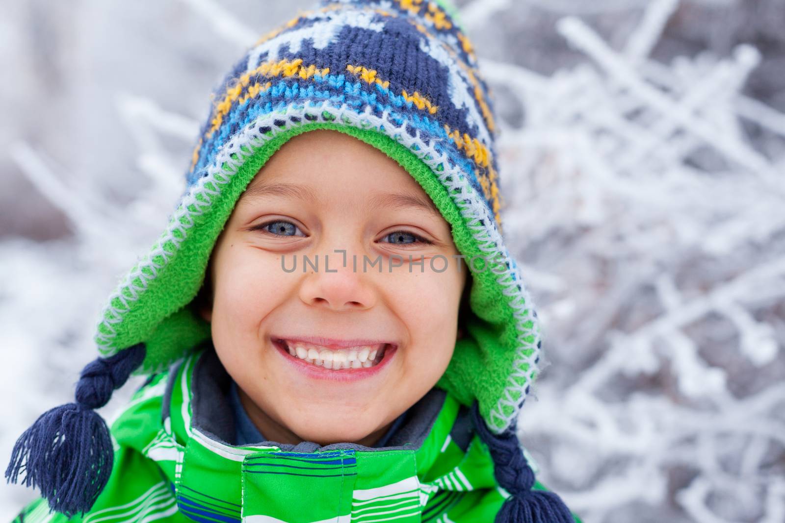 Portrait of a little boy in the snow