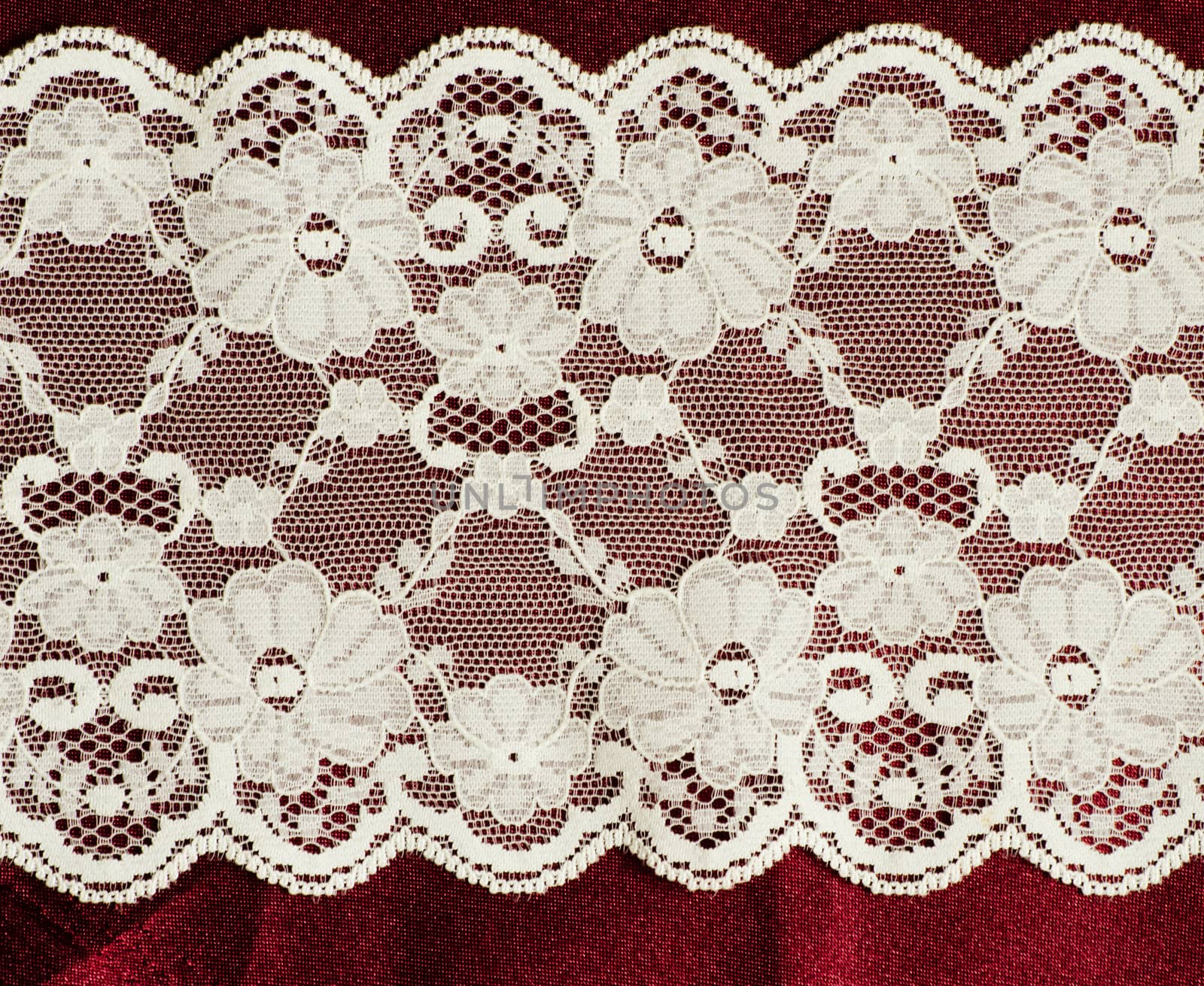 lace on the red satin fabric by sarkao