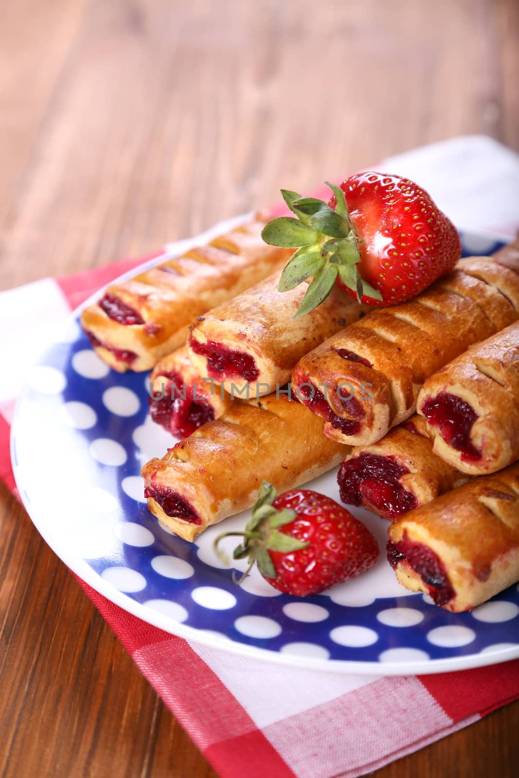 cakes with fresh strawberry on blue plate