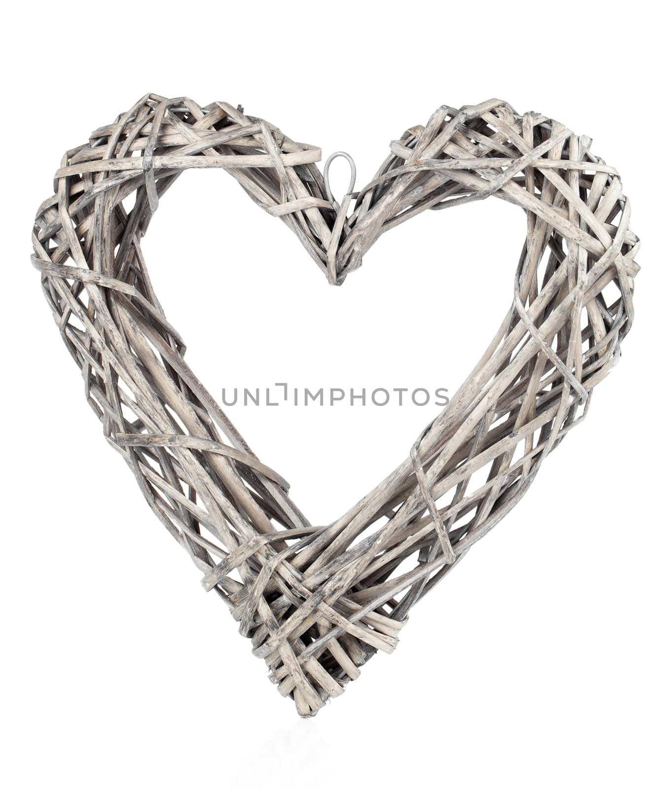 Heart shaped decoration made of wood, over white background by motorolka