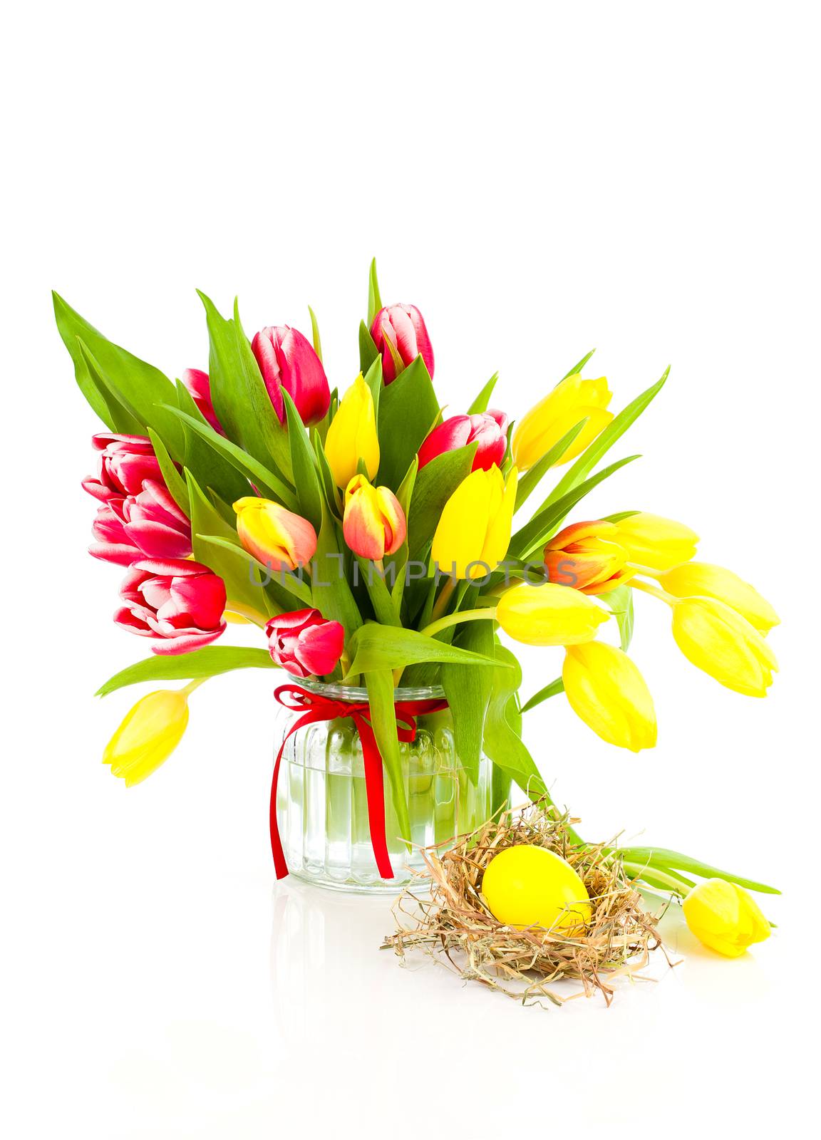 spring tulips with easter eggs on white background