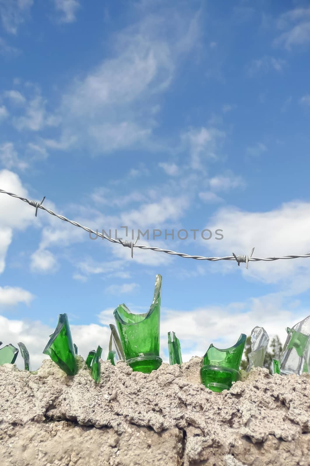 broken glass and barbed wire security