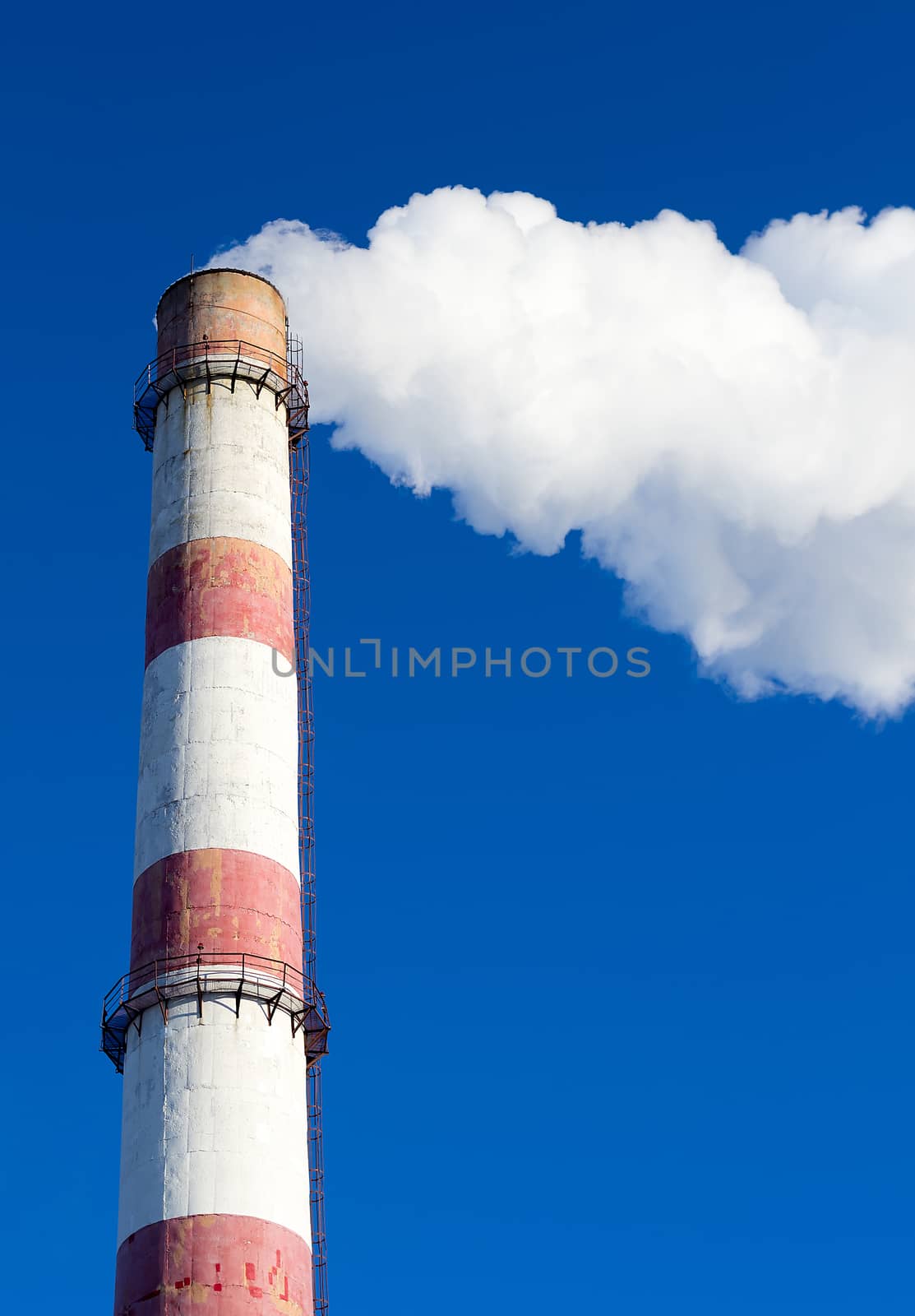 picture tubes for heat power plant with clouds of smoke on a blue background