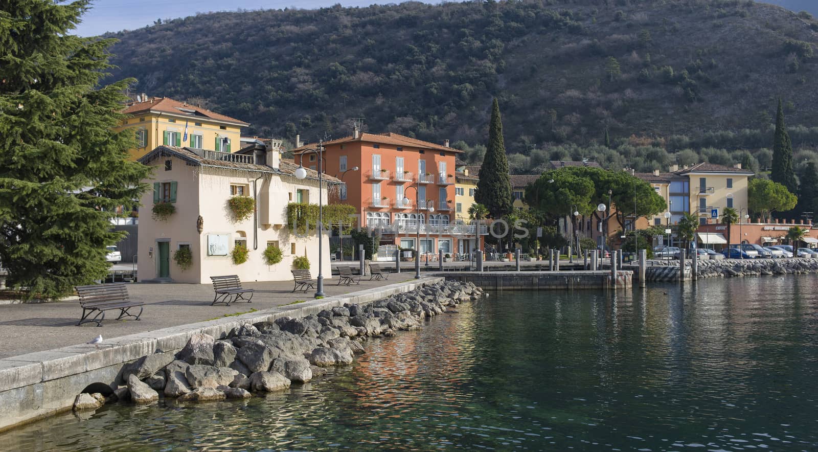 A vacant boardwalk by the lake Garda in the northern Italy.