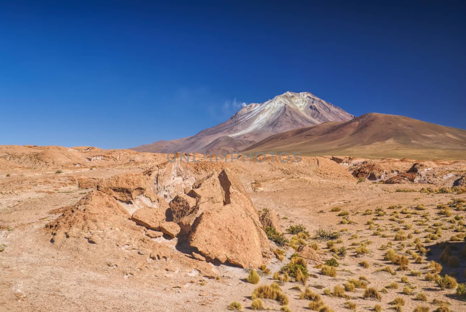 Picturesque volcano near salt planes Salar de Uyuni in bolivian desert