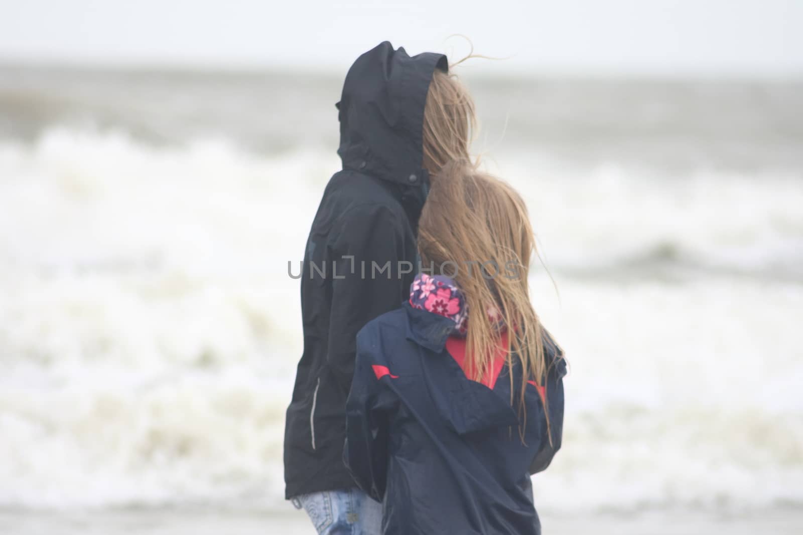 two blonde sisters on the beach