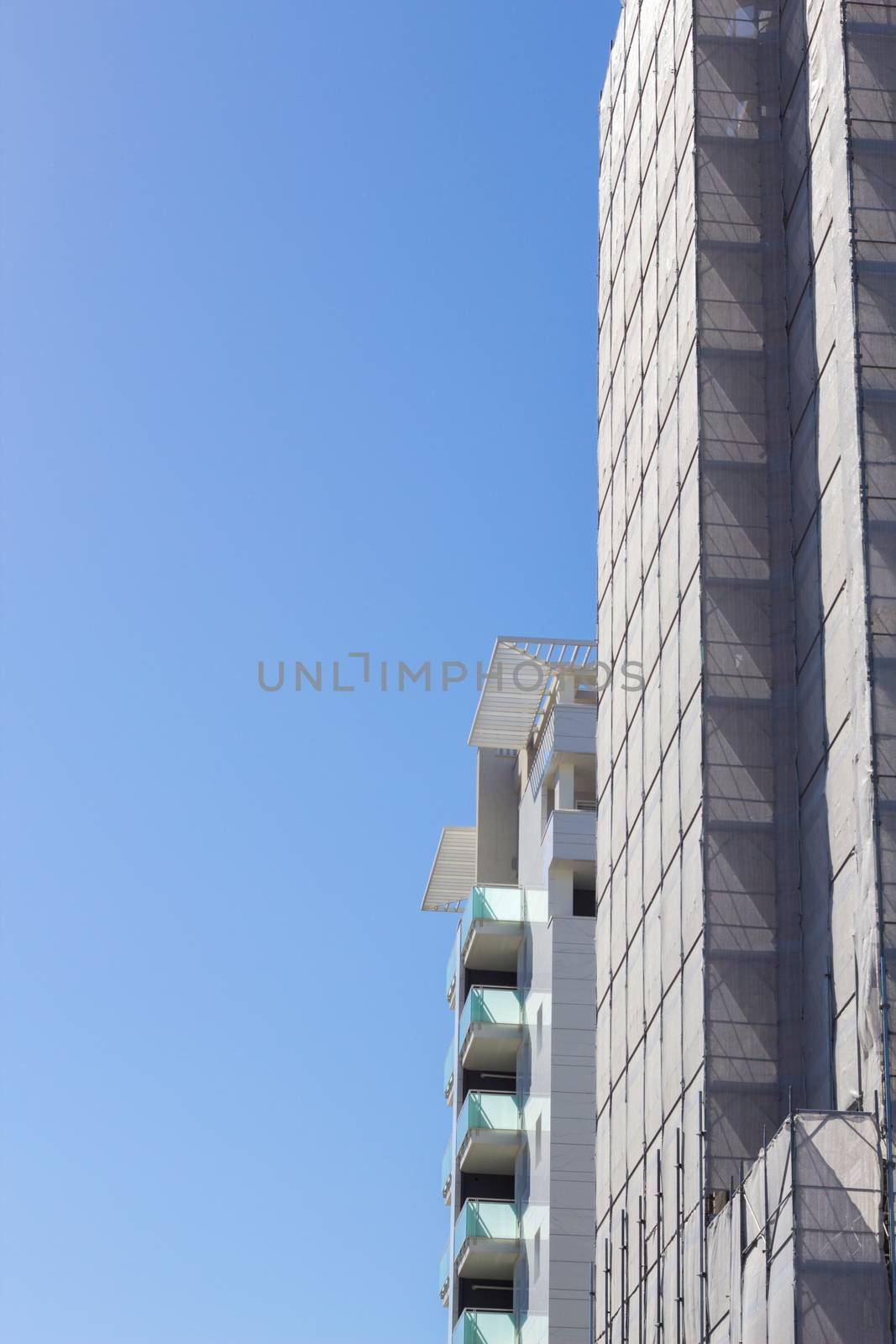 Vertical image of two buildings under construction