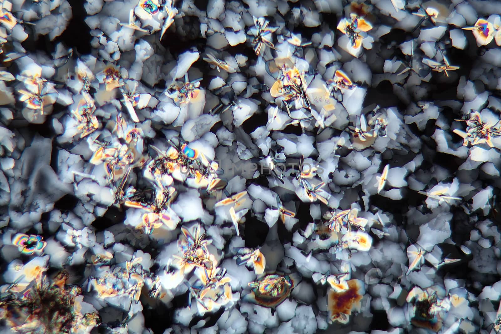 Potassium sulfate under the microscope (magnification 80x and polarized light). Potassium sulfate is a common reagent in fertilizers.