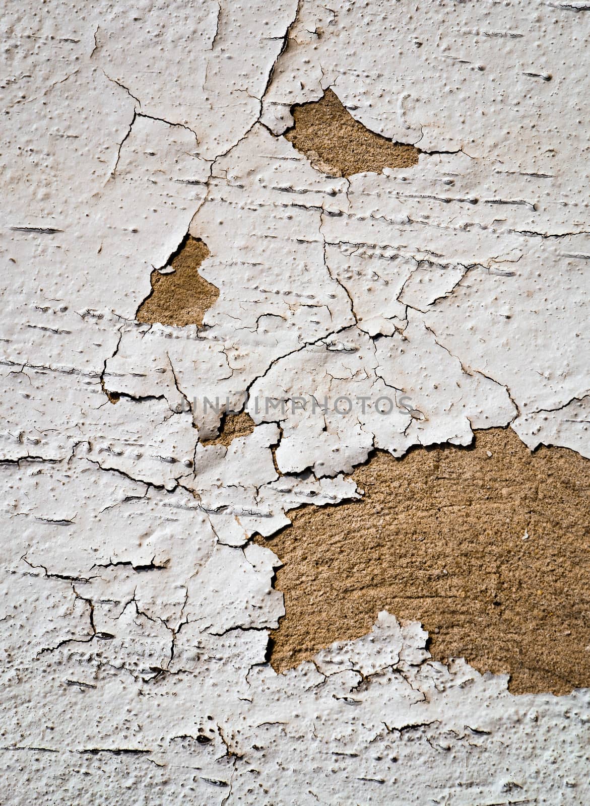 abstract background or texture cracks in white plaster