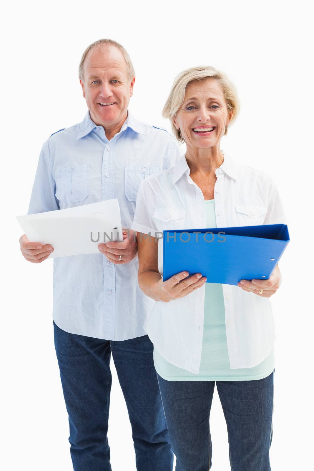 Happy mature students holding folders on white background