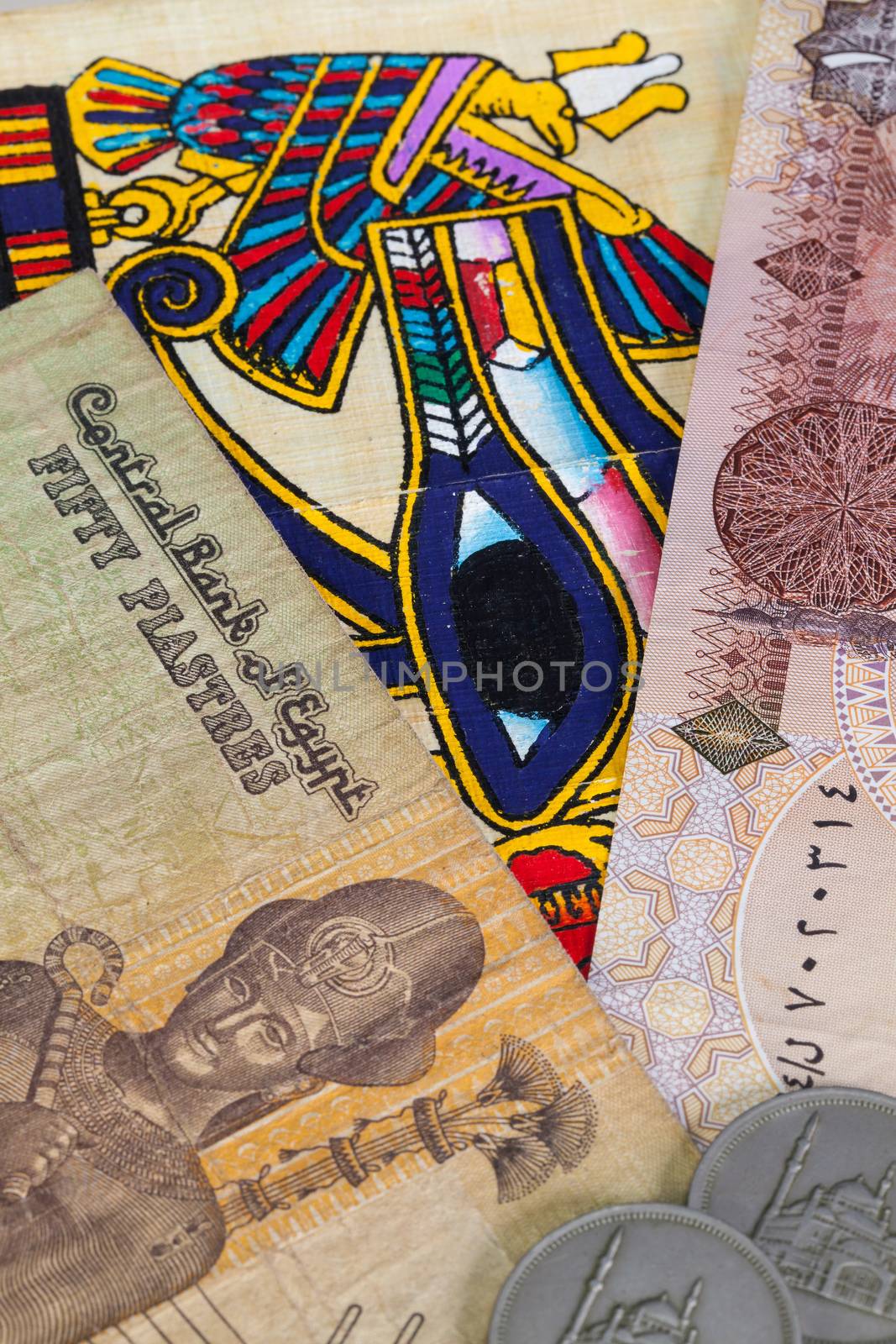 Typical Egyptian hieroglyphics on papyrus and different banknotes