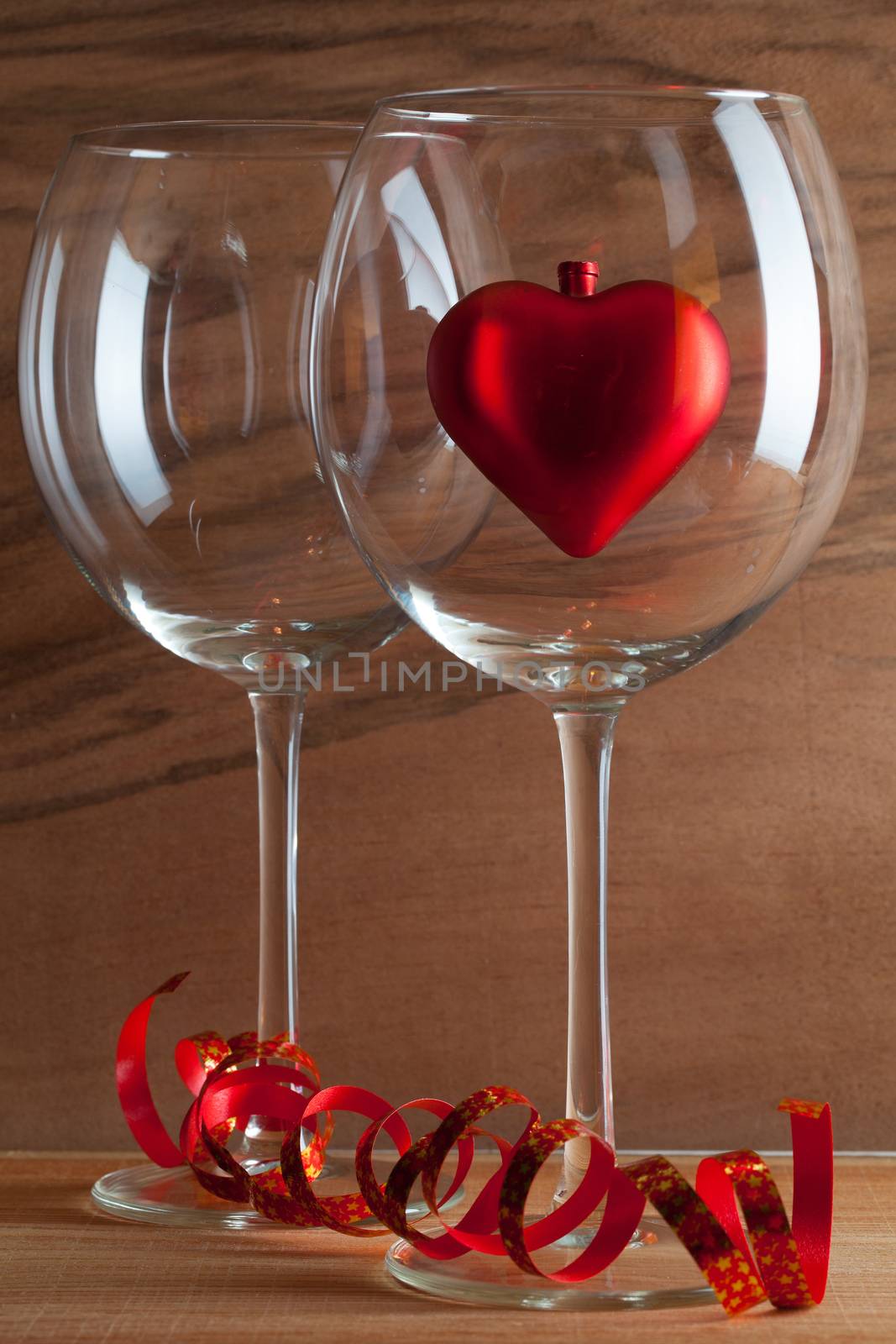 Two glasses  of wine and red heart by CaptureLight