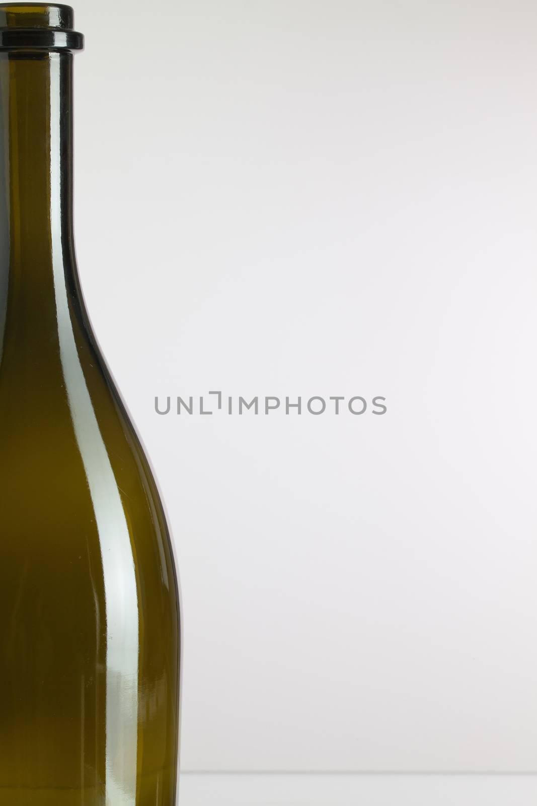 Detail of empty wine bottle on a white background