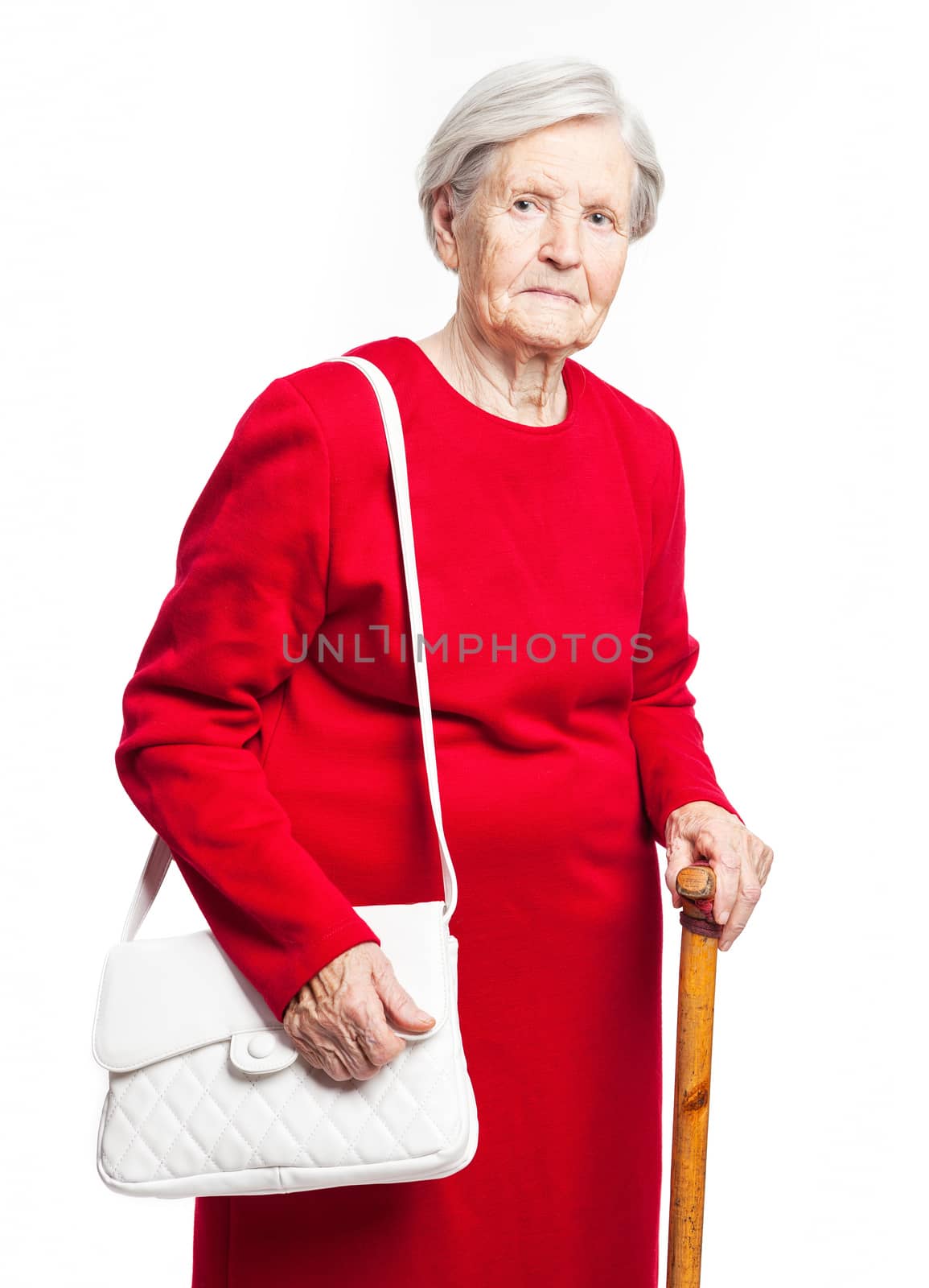 Elegant senior woman standing over white background