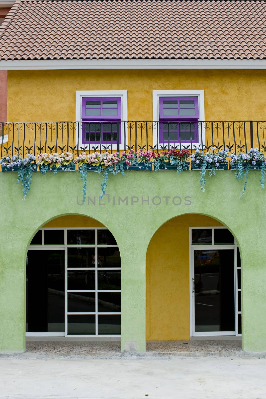 Colorful house with violet and white windows