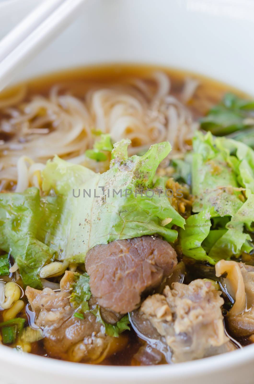 rice noodle soup with pork and vegetables