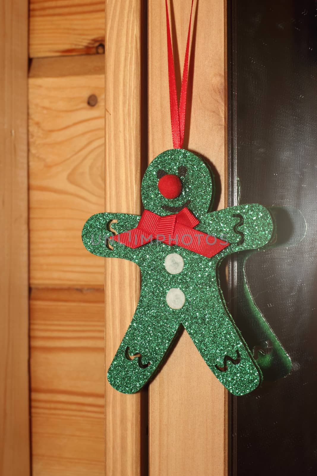 Green Christmas toy man  by Metanna
