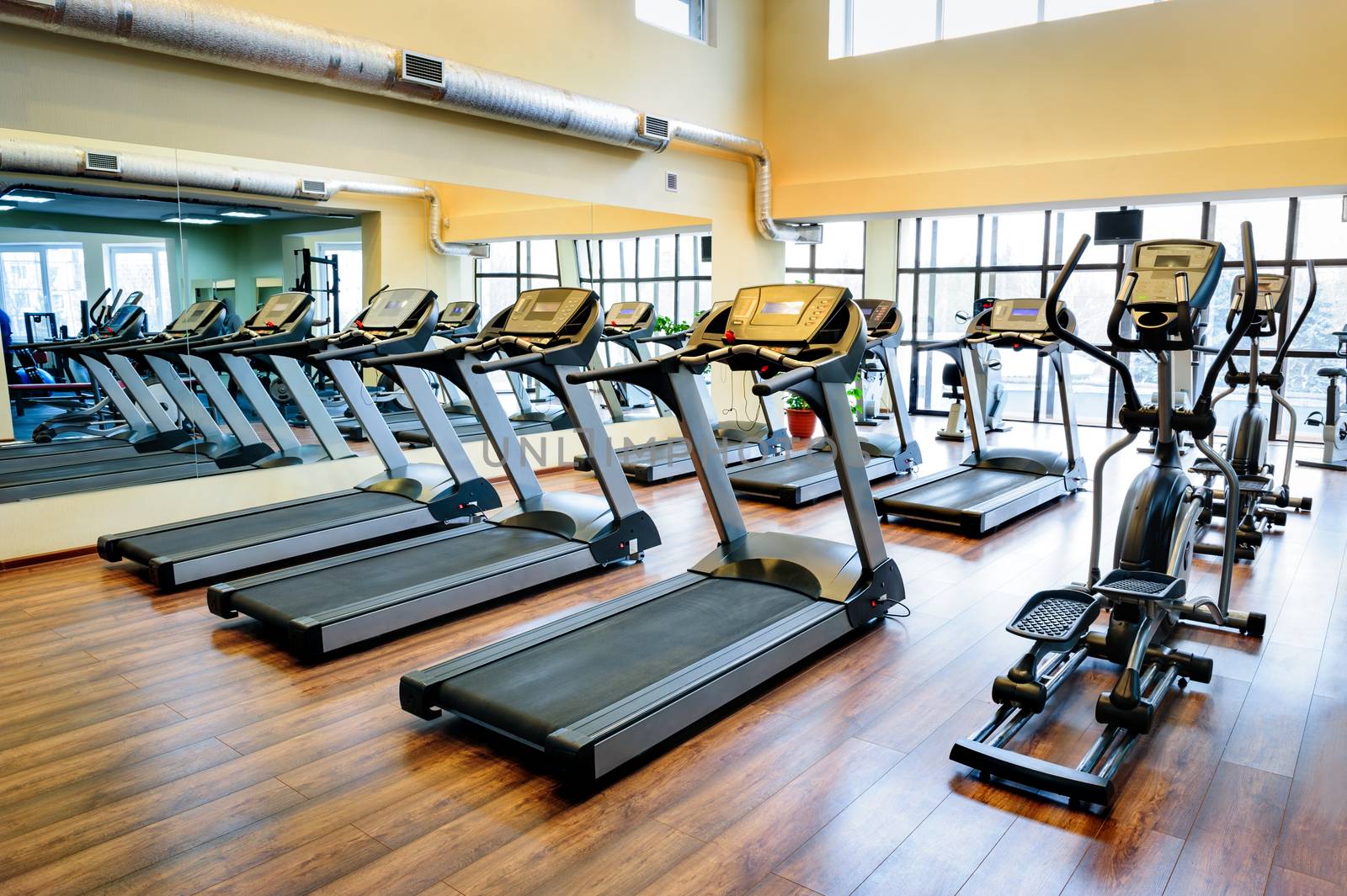 Set of treadmills staying in line in the gym