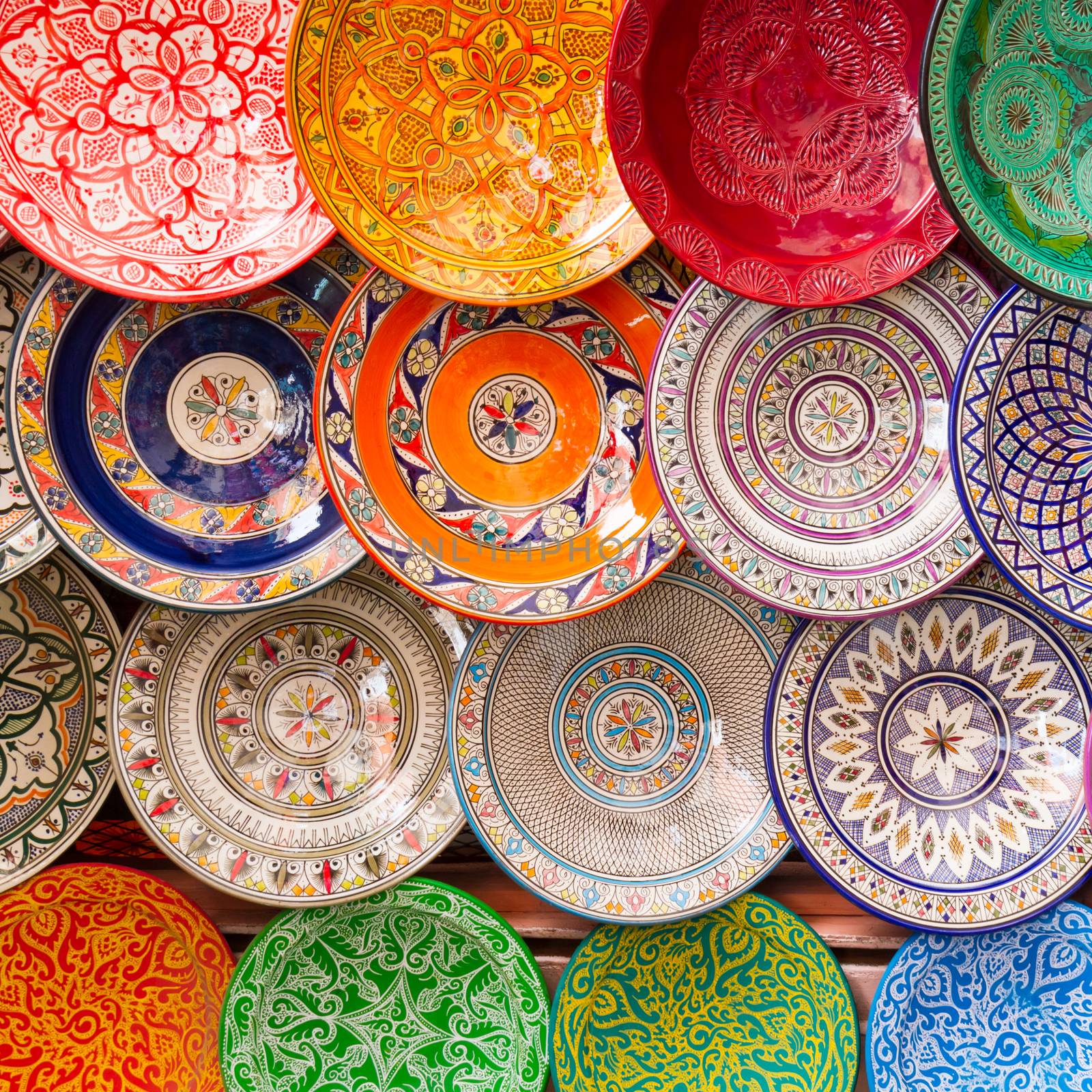 Traditional arabic handcrafted, colorful decorated plates shot at the market in Marrakesh, Morocco, Africa.