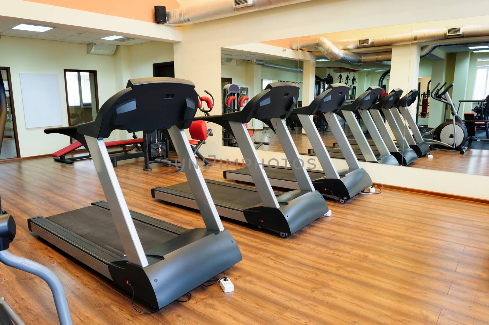 Set of treadmills staying in line in the gym